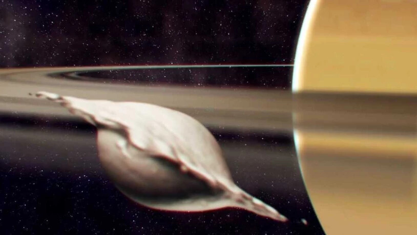Entstehung von Atlas, einem der kleinen, inneren Monde des Saturns. Seine flache, ravioliartige Form kam bei der Kollision und Verschmelzung zweier gleich grosser Körper zustande. Die Illustration zeigt einen Moment, bevor die Neuausrichtung des Mondes…